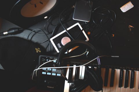 Headphones and speaker on a keyboard